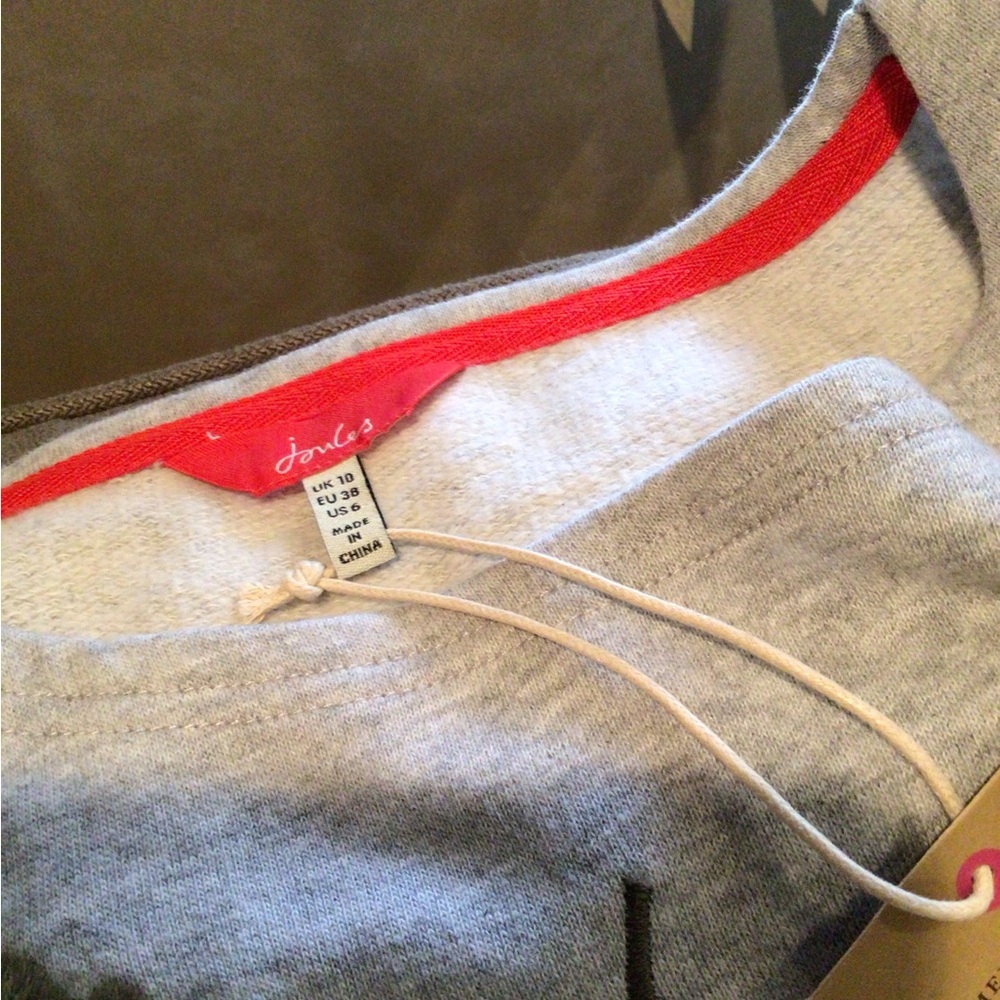 Joules sweatshirt with embroidered front and ruffle hem. - Picture 2 of 2
